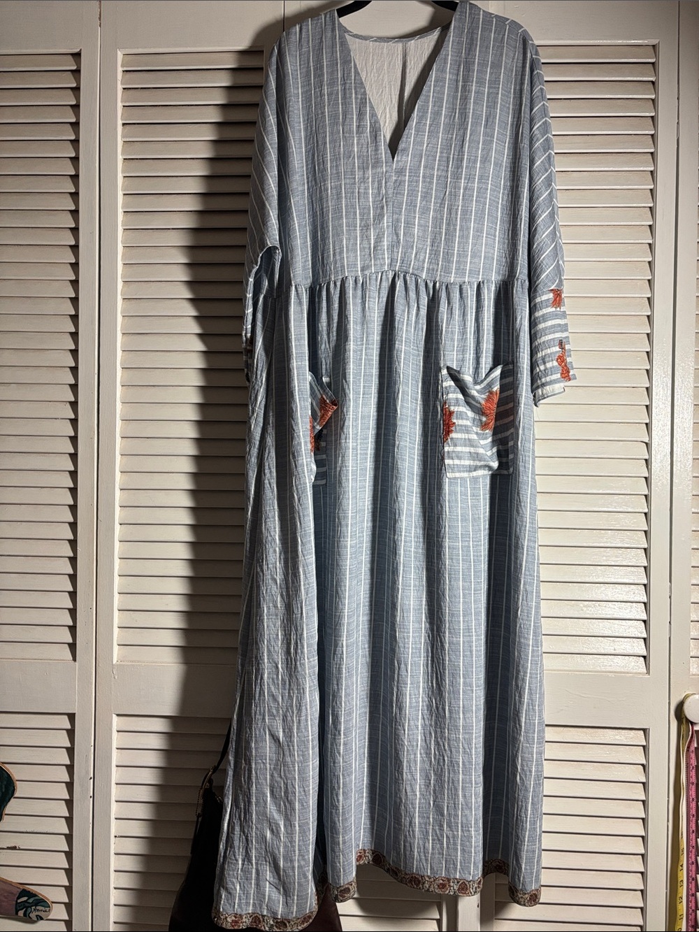 Striped V-Neck Maxi Dress with printed Pockets and edges.